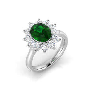 Pre-Owned Oval Emerald and Diamond cluster ring made in Platinum