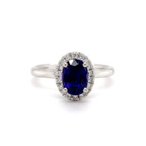 Pre-Owned Blue Purple Sapphire and Diamond halo ring in Platinum